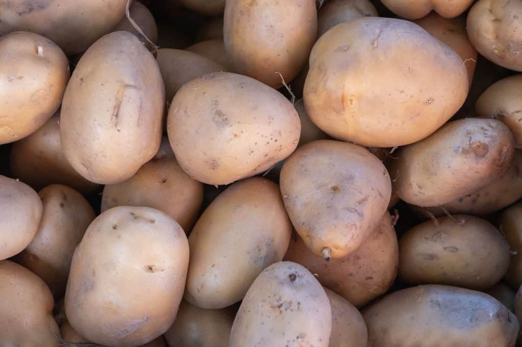 Close-up of fresh organic potatoes at a local market in Bornova, İzmir, showcasing healthy produce.